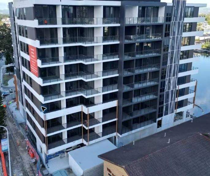 Urban mid-rise development with coordinated window openings across the facade