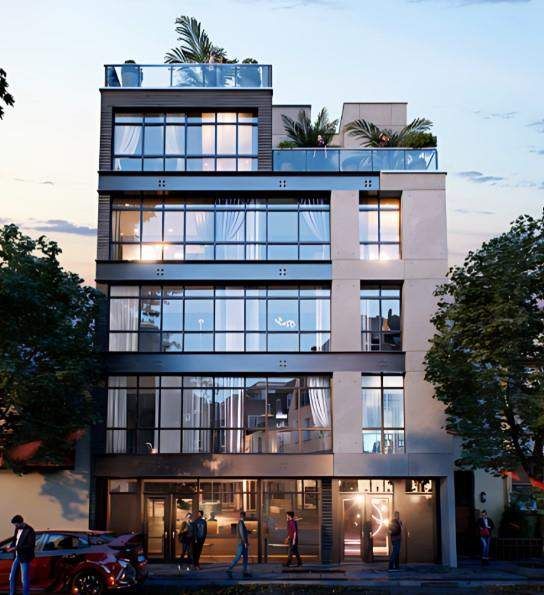 Full front view of a modern mid-rise building with a glass facade