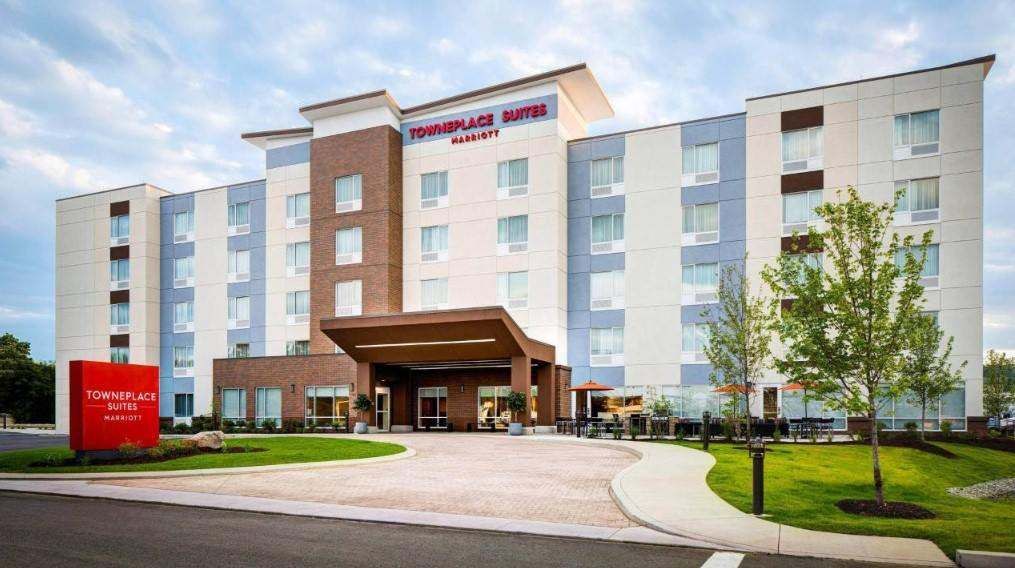 Full front view of a TownePlace Suites hotel with impact windows