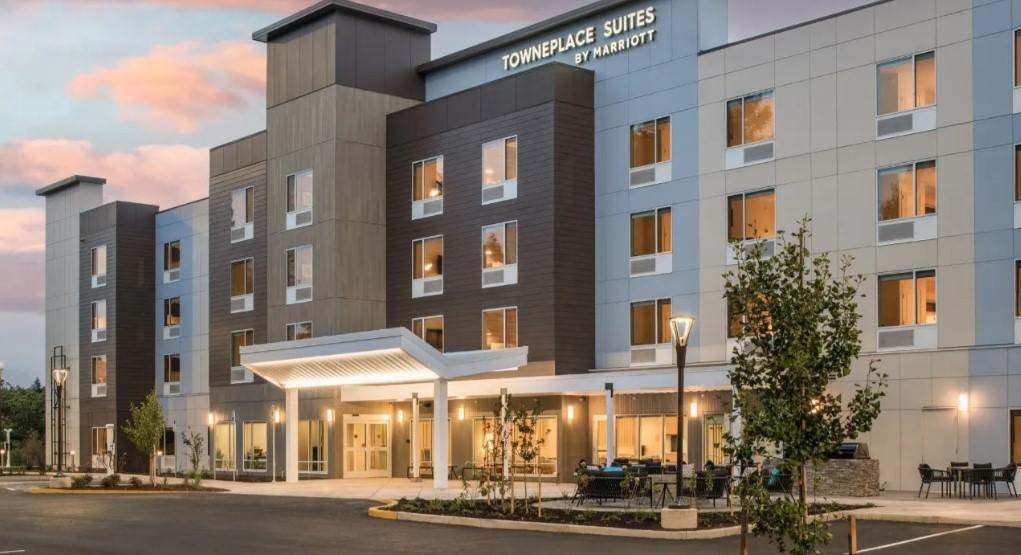 Evening exterior view of a modern TownePlace Suites hotel