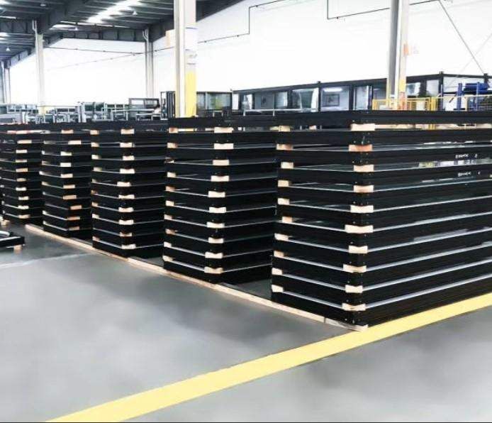 Prepared window frames stacked in a manufacturing facility